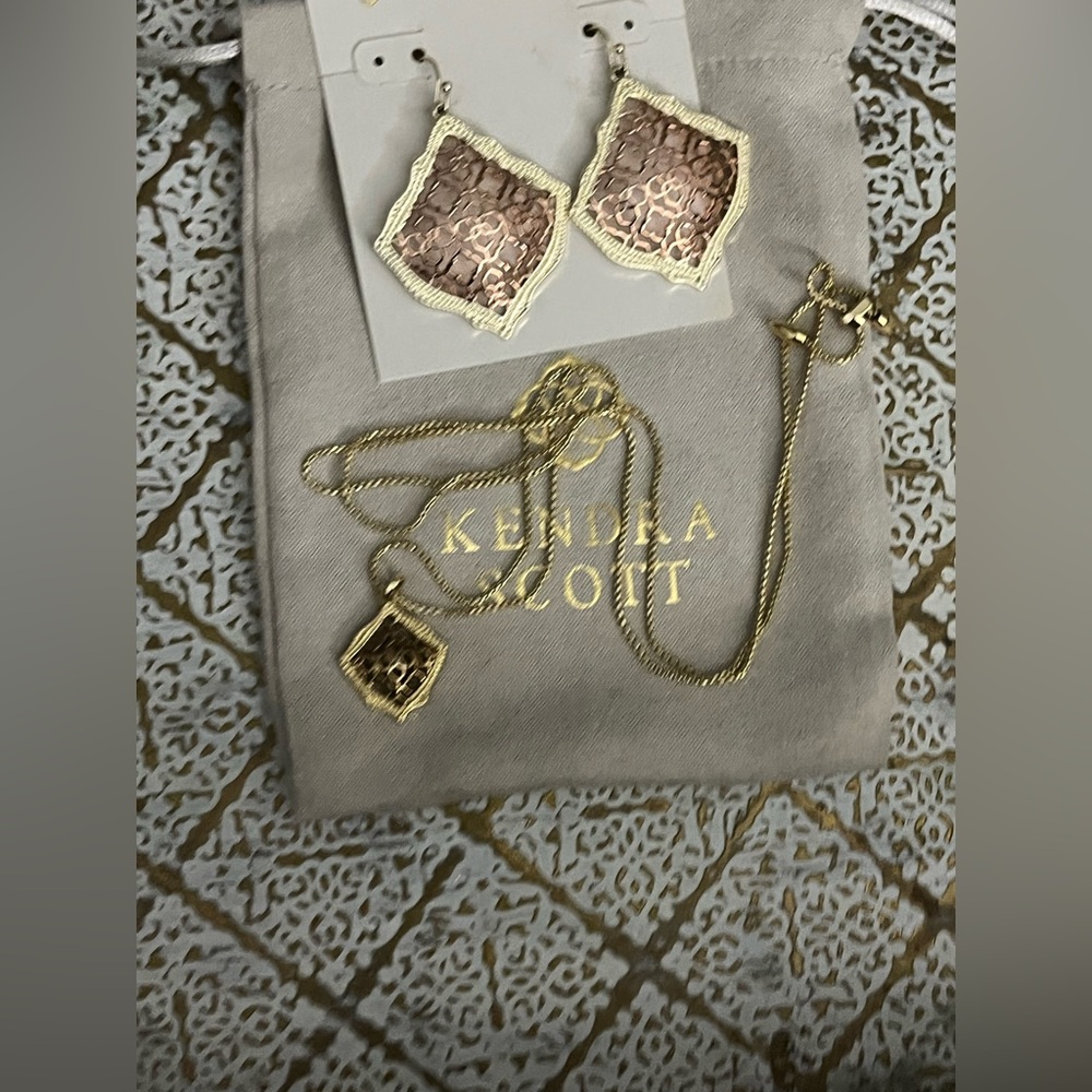 Kendra Scott Rose Gold and Gold Tristan earrings and matching long necklace.